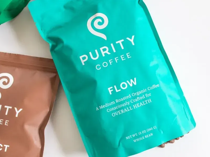 Purity Coffee FLOW medium roast whole bean bag with coffee beans and other Purity blends